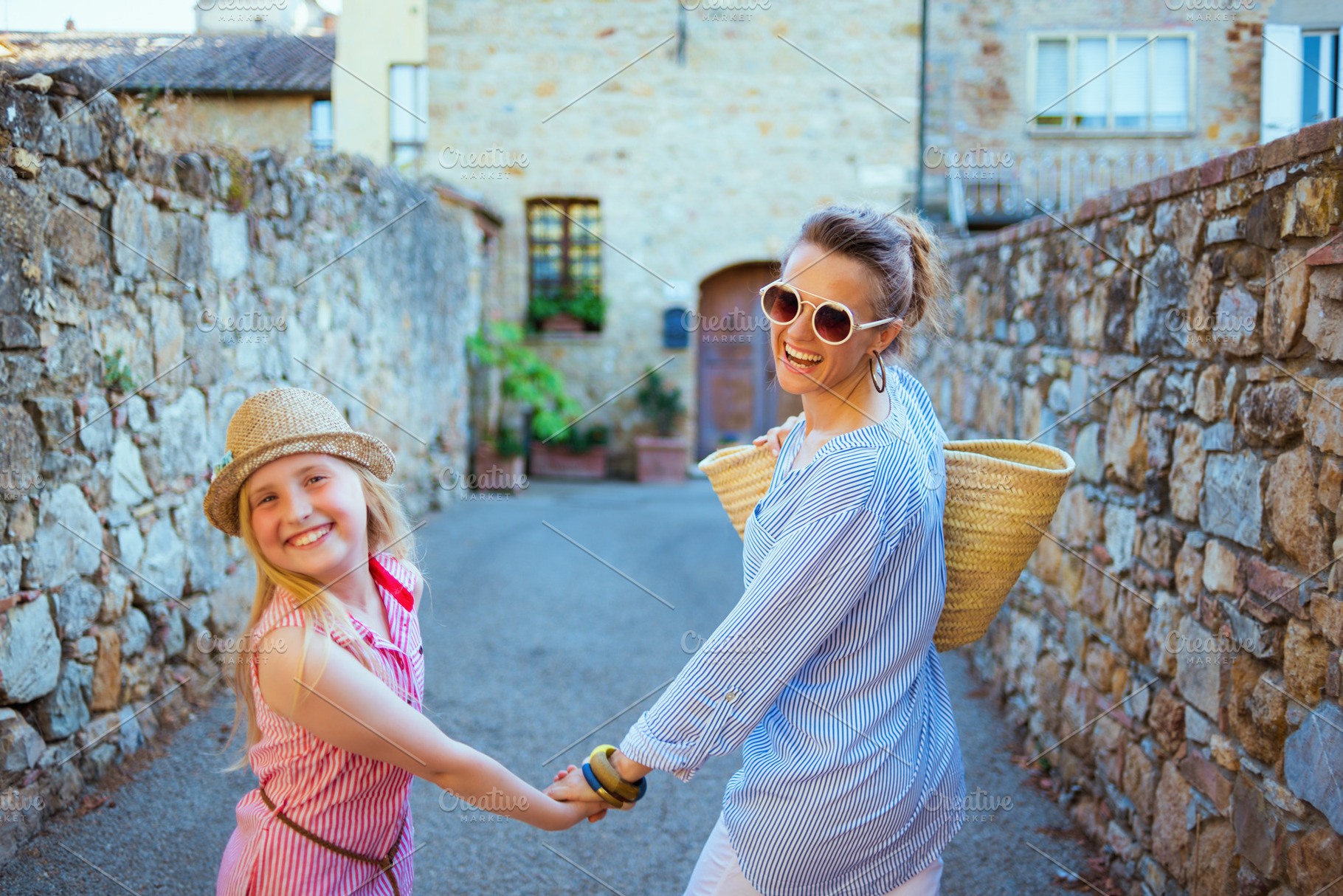 smiling mom and child tourists in Tuscany, Italy sightseeing, a Person Photo by Alliance Images