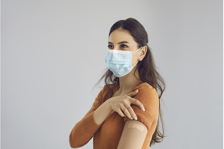 Happy woman wearing medical face, a Person Photo by StudioRomantic
