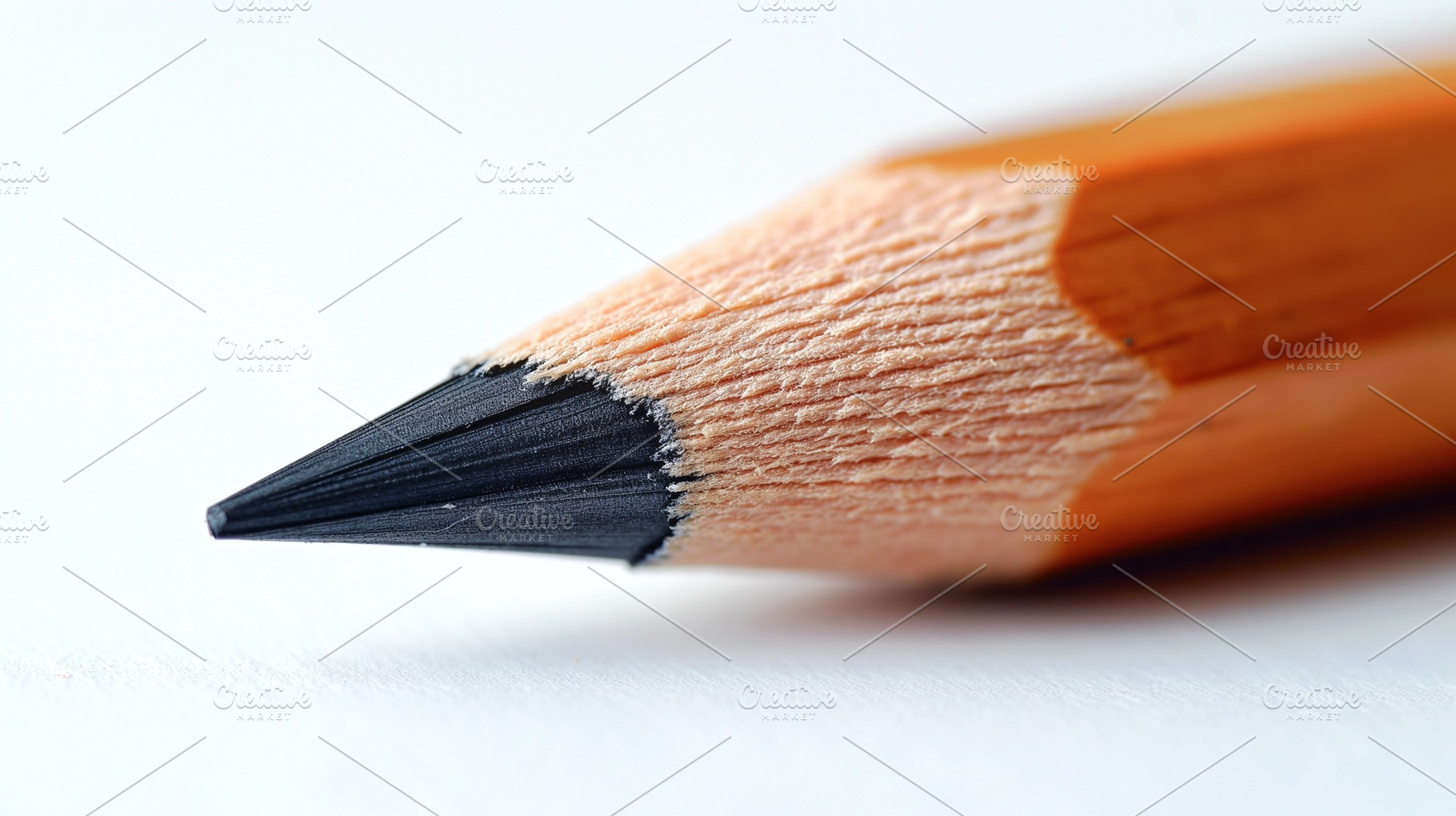 Close-up of a sharpened wooden pencil highlighting its fine tip and natural tex, a Background Photo by ImageMir