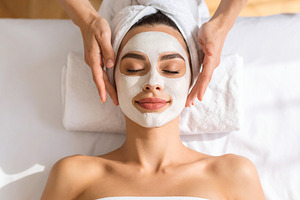 Woman face lying at bed with face mask applied reciving skin tre, a Beauty & Fashion Photo by DanFLCreativo