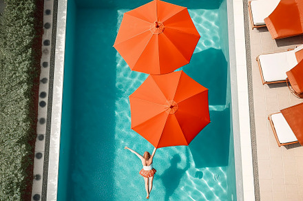 Girl in the pool from above, a Person Photo by huertas19