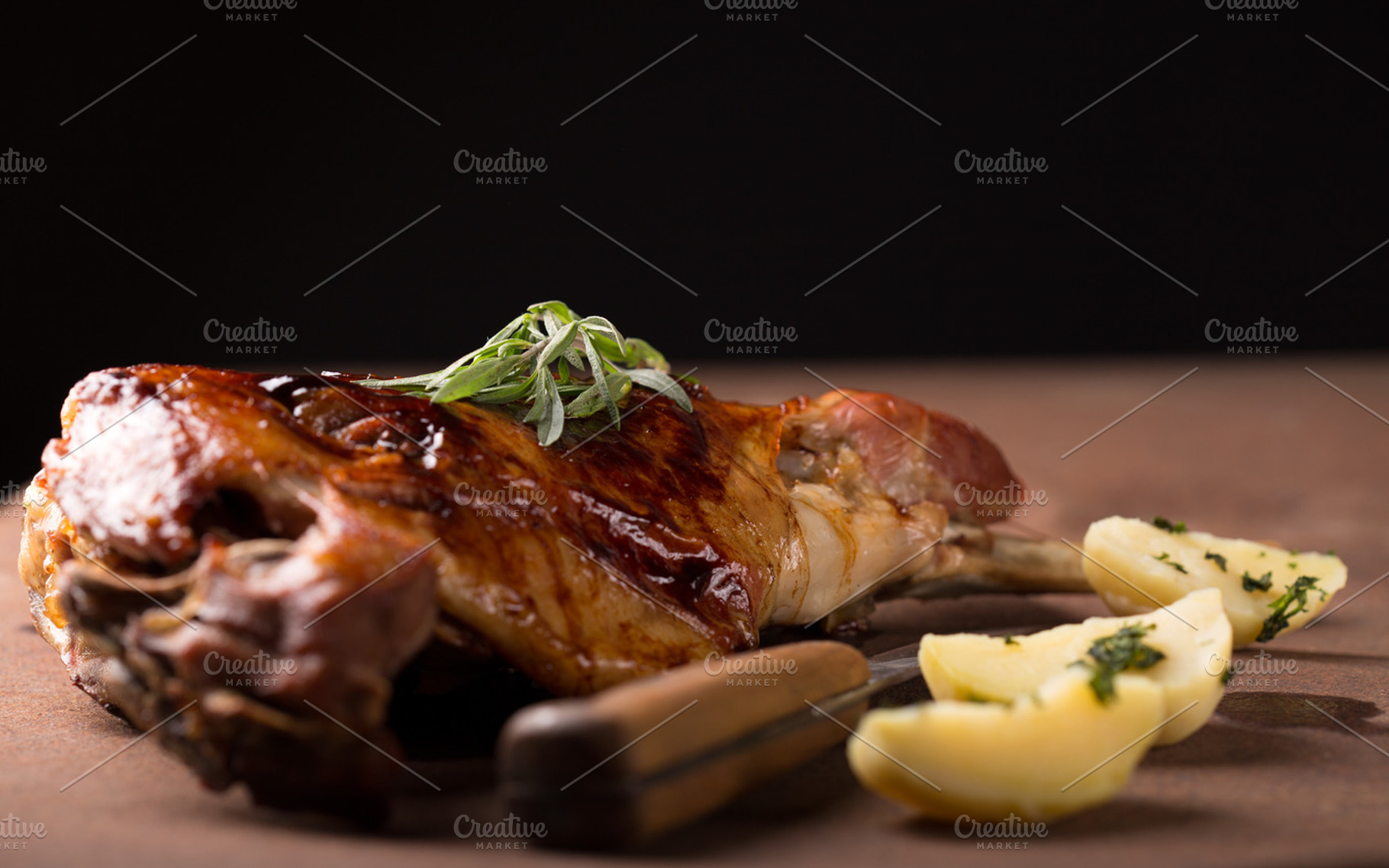 Roasted lamb leg containing animal, bone, and dinner, a Food & Drink Photo by peterzsuzsa