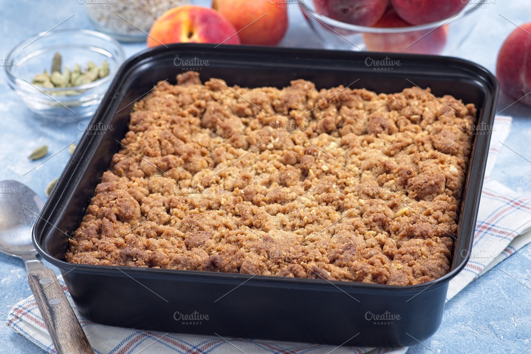 Delicious Peach Crisp or cobbler with brown sugar and oat streusel in backing d, a Food & Drink Photo by iuliia_n