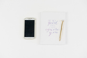 White notebook with phone on desk containing desk, rebecca nash photography
