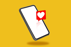 Smartphone With Empty Screen And Heart Icon Over Yellow Background, a Photo by Prostock-Studio