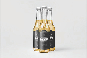 Standing Glass Beer Bottles Mockup, an Advertising Mockup by DesignRushMarket