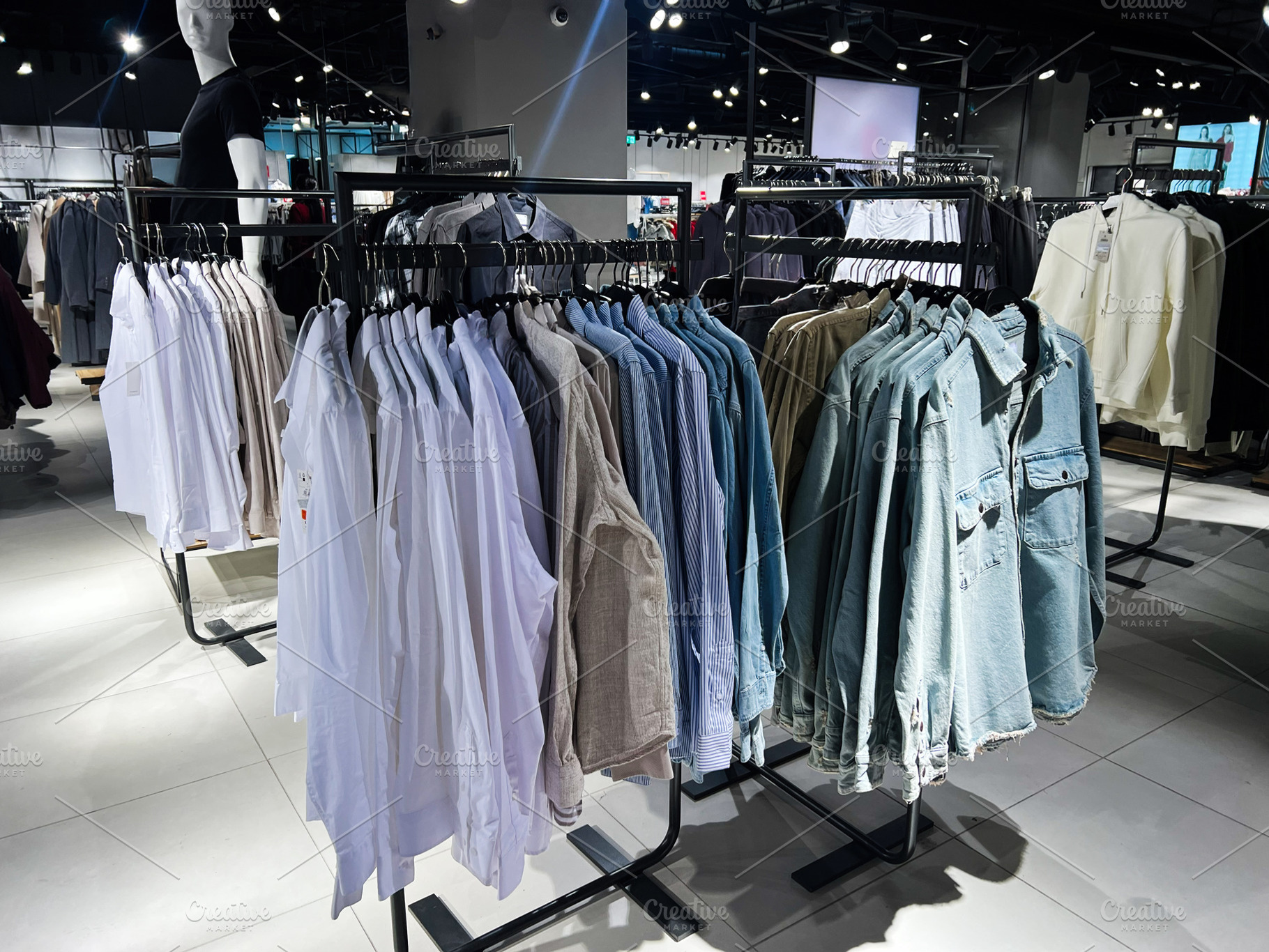 Clothing display in a modern store with stylish and arranged garments on racks, a Photo by AS photostudio