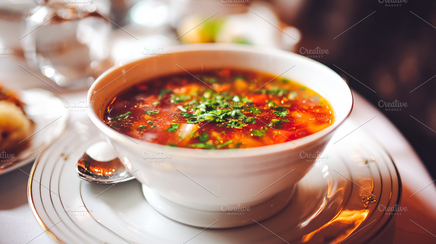 Hot vegetable soup with fresh herbs, an appetizer serving in a f, a Food & Drink Photo by Studio ANNA