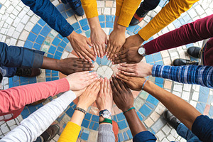 Hands assembling a mosaic of interlocking puzzle pieces, a Person Photo by DanFLCreativo