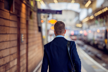 Businessman in suit walking at the staition back view featuring subway, a Person Photo by HalfPoint