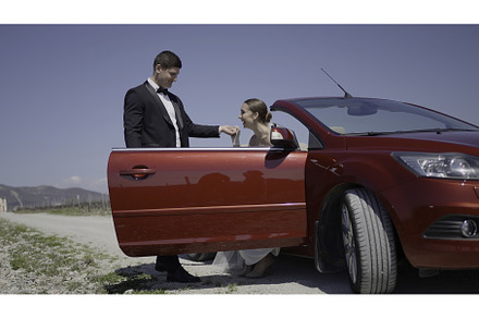 Newlyweds by the convertible car, a Person Photo by Media Whale Stock