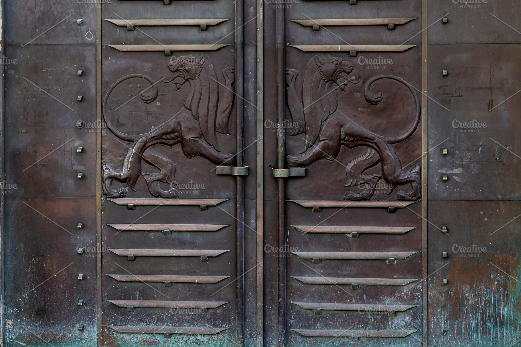 Two lions carved on iron and wooden, an Abstract Photo by Imaginarium