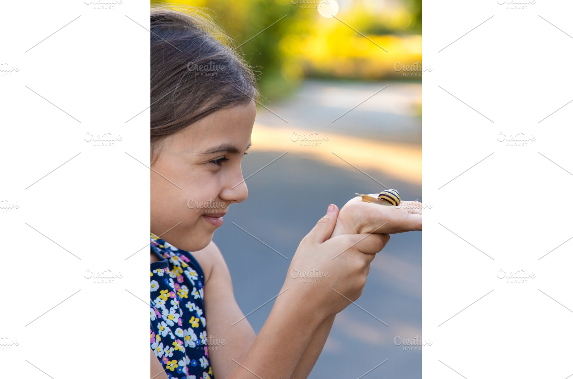 A child is studying a snail in the, a Nature Photo by yanadjana
