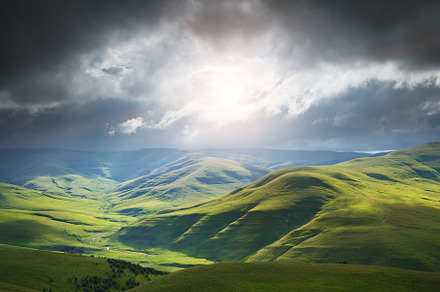 Green mountain hills during the epic sunset, a Background Photo by djgis