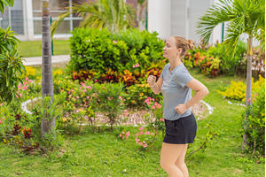 Unaltered woman exercising in a park, a Sports & Recreation Photo by Elizaveta Galitskaya