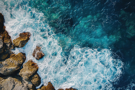 Aerial view of a blue ocean waves, a Photo by Pavel_design