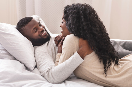 Smiling black couple having fun in b, a Photo by Prostock-Studio