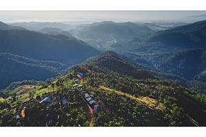 Aerial view of small village nestled, a Nature Photo by Goinyk