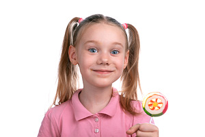 Cheerful young girl in a pink shirt smiling while holding a colo, a Person Photo by Ales Munt