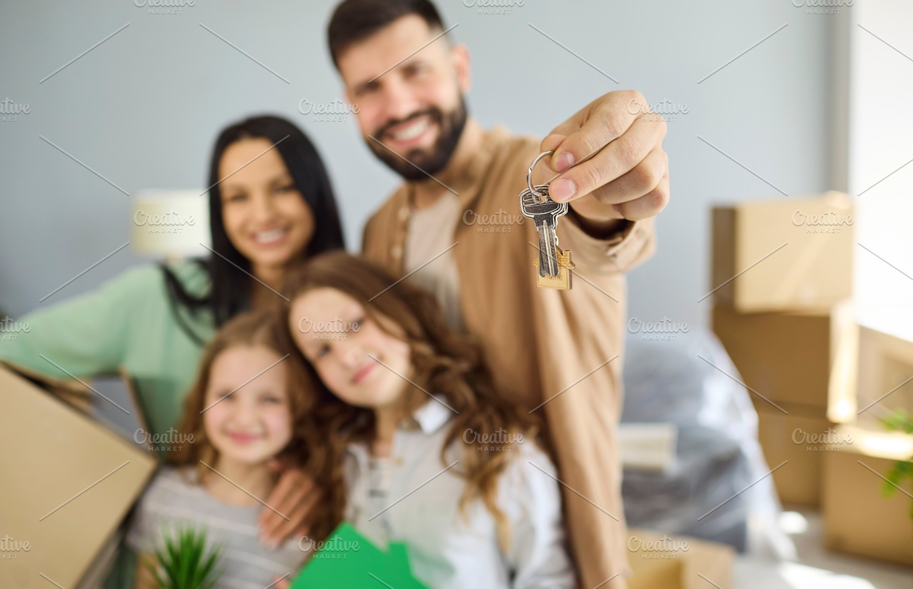Family Holding New Apartment Keys, a Person Photo by StudioRomantic