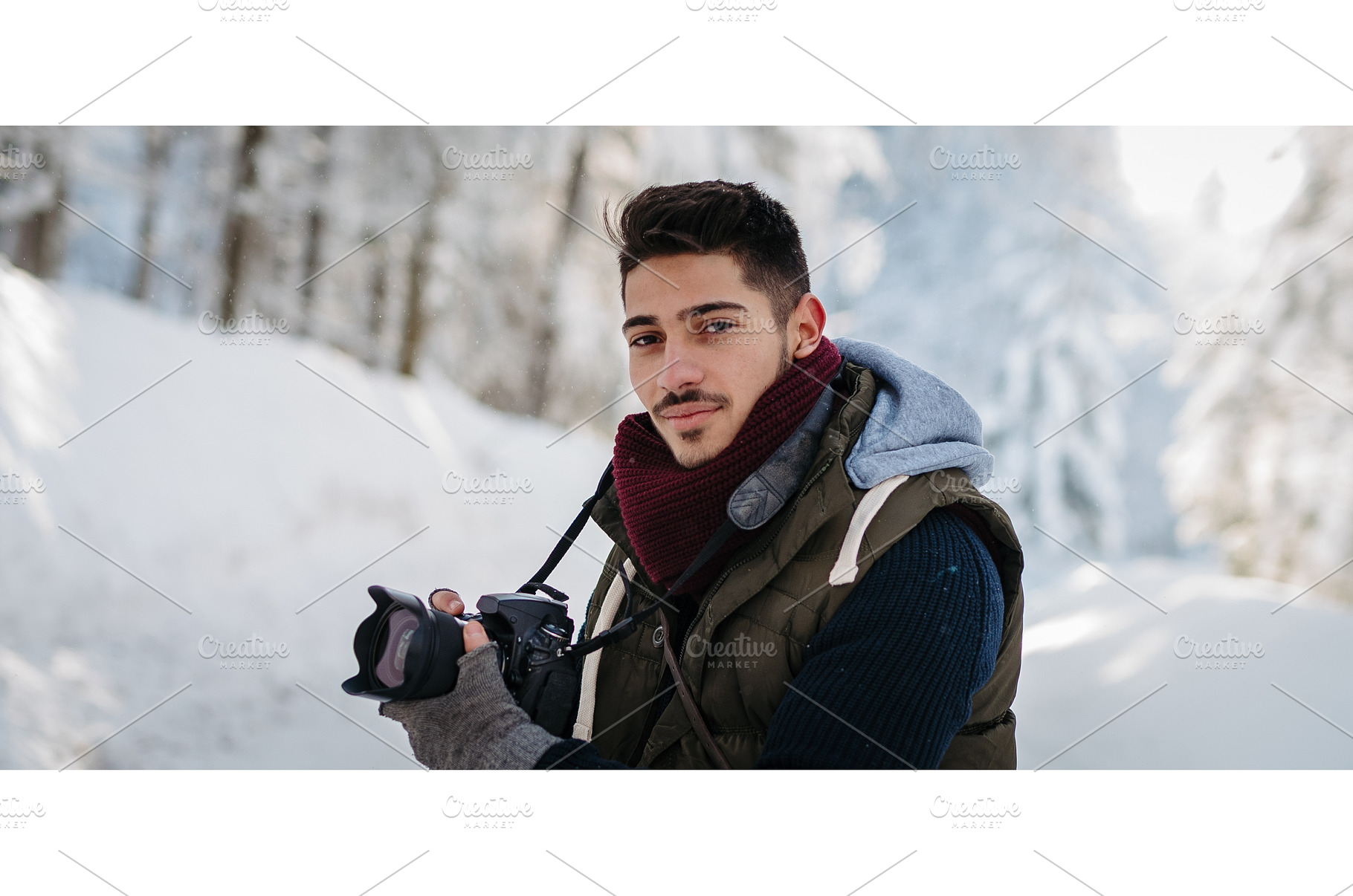 Male photographer holding camera, a Beauty & Fashion Photo by HalfPoint