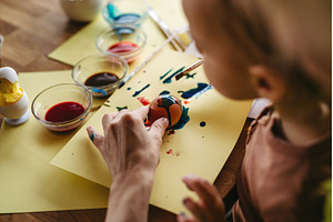 Close up of little boy decorating, a Holiday Photo by HalfPoint