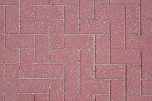Detail of reddish outdoor paving laid with a stylish pattern, a Background Photo by Davizro's Market