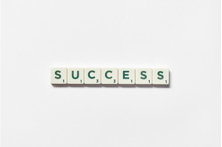 Success formed of scrabble tiles on, a Business Photo by Yaroslav Danylchenko