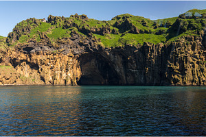 View of Heimaey island off the coast, an Animal Photo by Backyard Stock