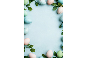 Pastel easter eggs and green leaves, a Holiday Photo by Lermont51