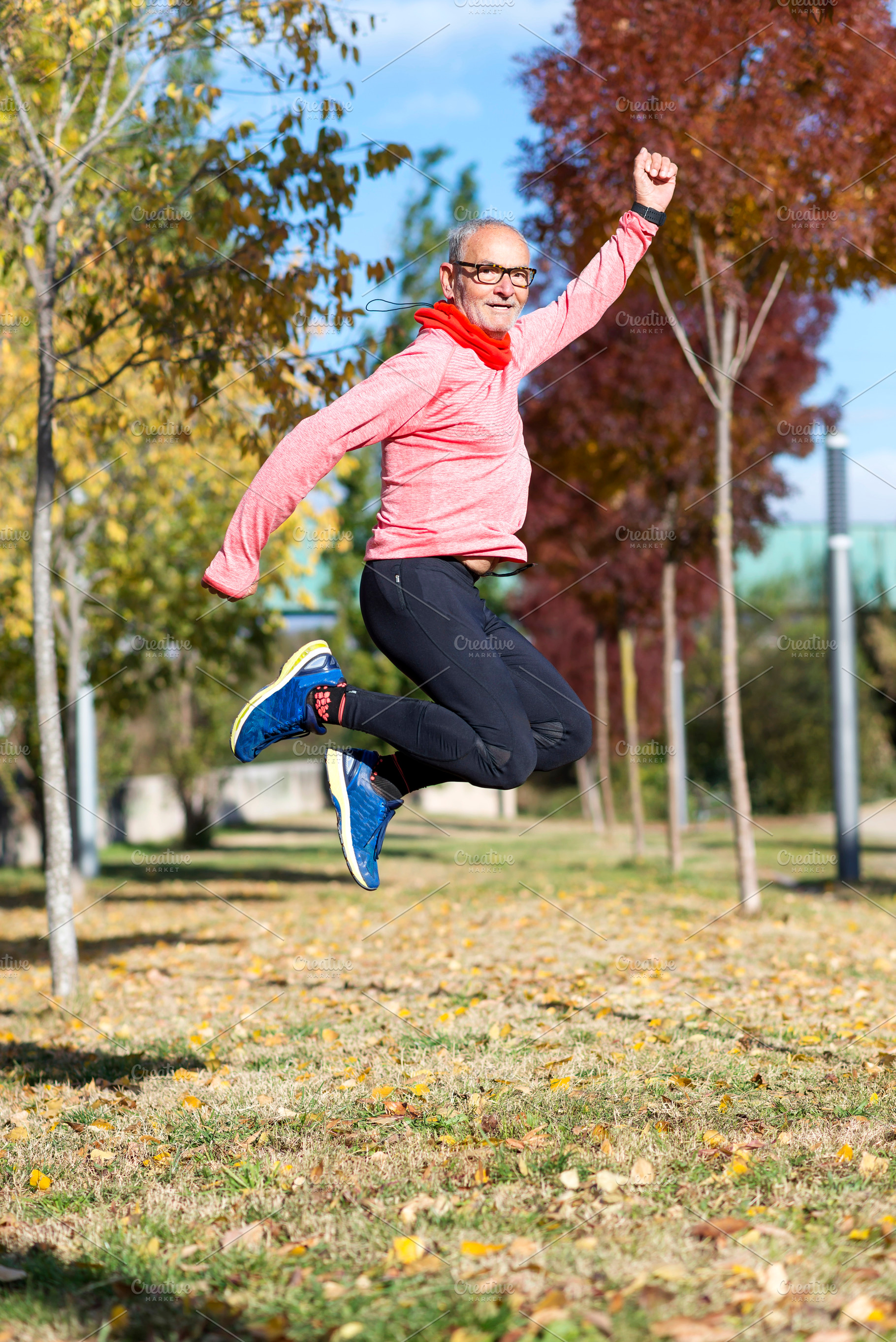 Senior man jumping high outdoors, showing energy and joy, a Sports & Recreation Photo by RF Images