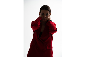 Woman posing in a red blazer, a Person Photo by volodymyrshtun13795