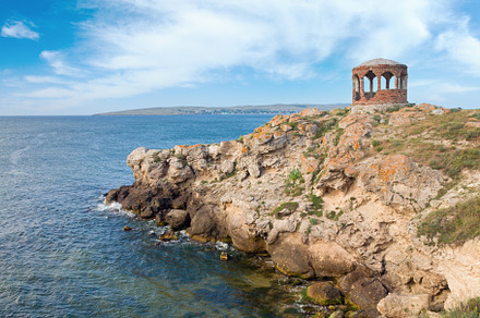 Rocky summer coastline and cape with pavilion, a Nature Photo by YuriyB