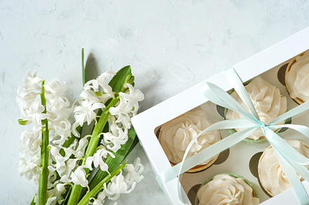 Gift box and white flowers on rustic table for March 8, International Womens day, Birthday or Mothers day, beautiful spring card