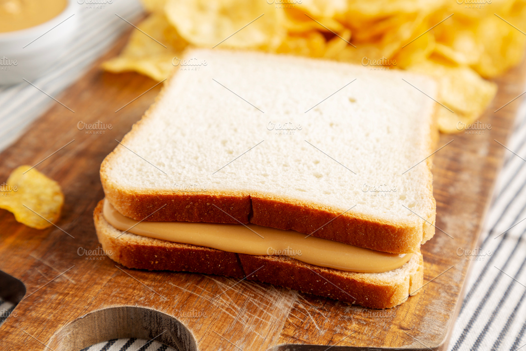 Homemade American Peanut Butter Sandwich on a Wooden Board, side, a Food & Drink Photo by LiudmylaChuhunova