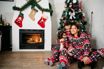 Family wearing matching Christmas pajamas, a Holiday Photo by YossSabalet