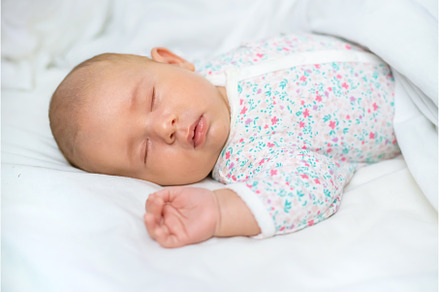 Newborn baby sleeps on a white bed, a Person Photo by yanadjana