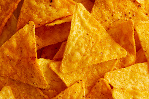 Crunchy Nacho BBQ Tortilla Chips, top view., a Food & Drink Photo by LiudmylaChuhunova