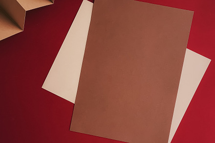 Beige and brown A4 papers as office stationery flatlay, luxury b, a Business Photo by Anneleven
