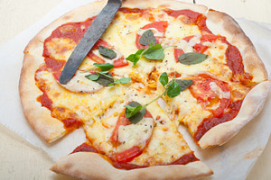 Italian pizza margherita featuring pizza, food, and cheese
