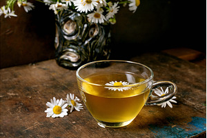 Chamomile Tea Cup with Fresh Daisy, a Food & Drink Photo by Natasha Breen