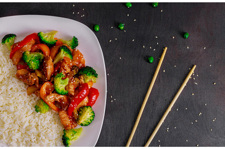 Chicken teriyaki on dark background, a Food & Drink Photo by Ungvar Studio