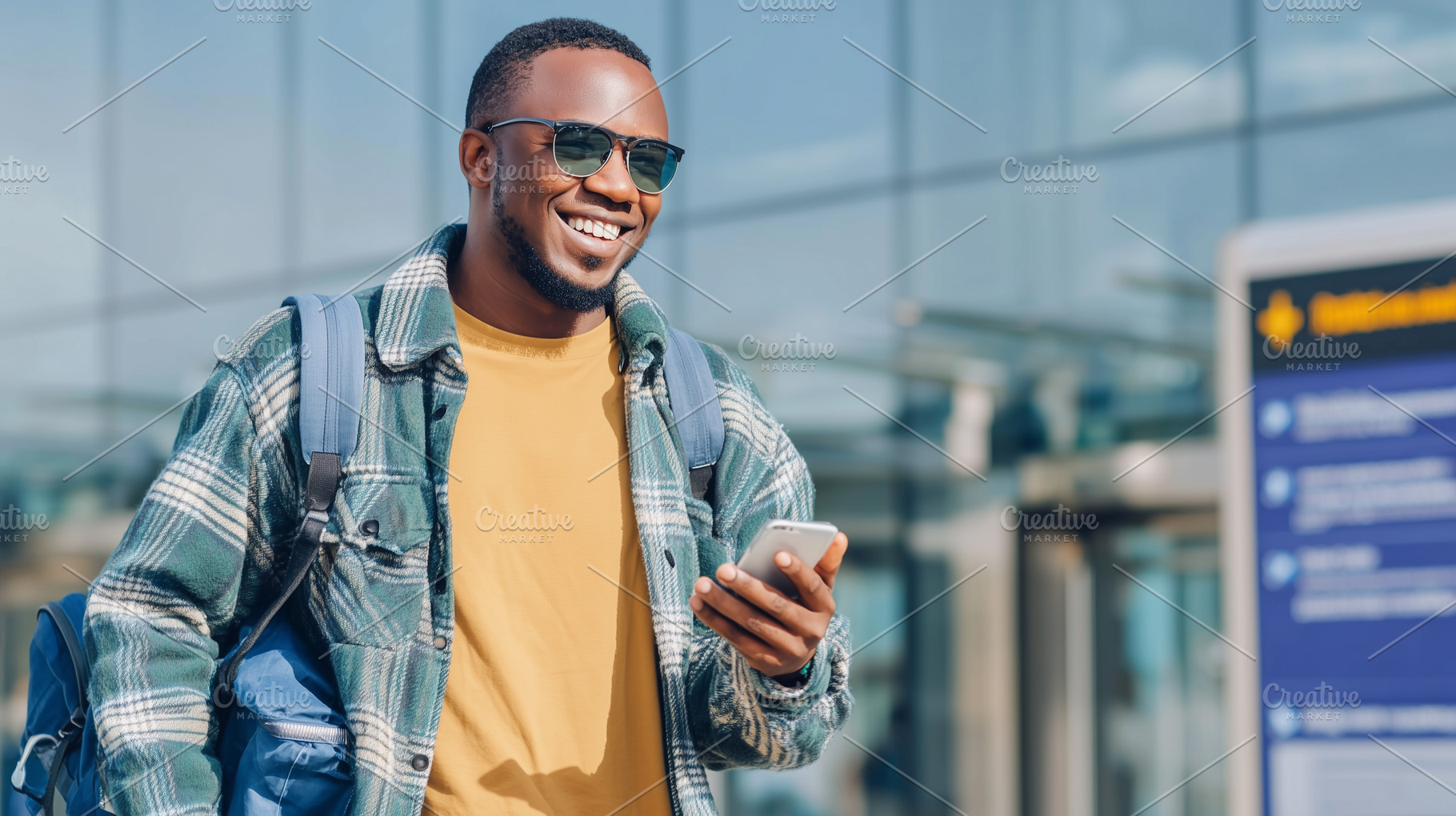 Smiling man in sunglasses checks, a Transportation Photo by MistyDay