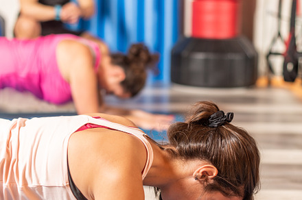 Close up of woman doing plank exercise in the gym, a Sports & Recreation Photo by Iván Moreno STOCK PHOTO