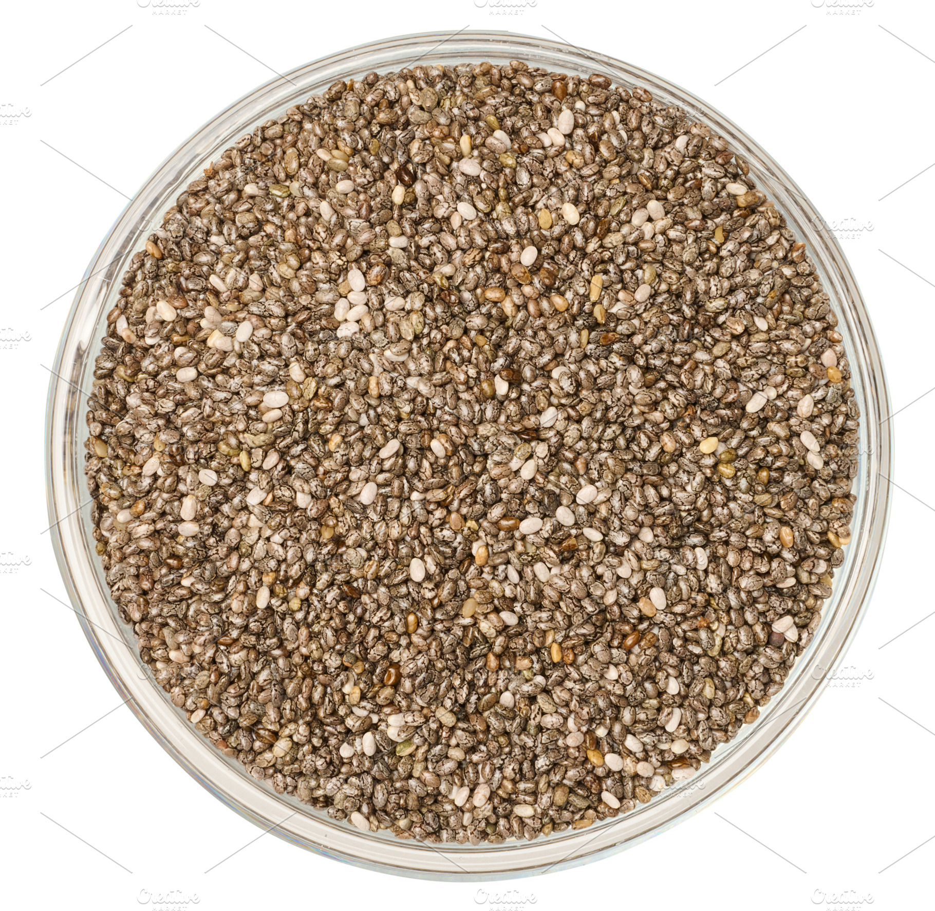 Chia seeds in a glass transparent bowl on an isolated background, a Food & Drink Photo by ndanko