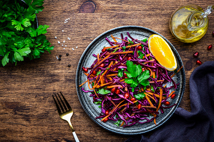 Coleslaw red cabbage salad with carrot, parsley, pomegranate and, a Food & Drink Photo by 5PH