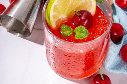 Cherry and lime alcoholic booze cocktail, a Food & Drink Photo by Rimma