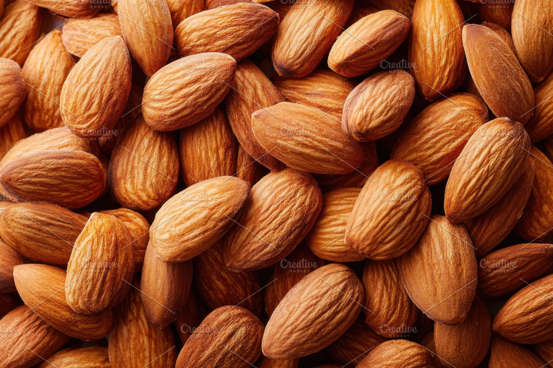 Background of roasted almonds nuts, a Food & Drink Photo by AlyaAnd
