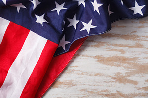 American flag close up on wood desk