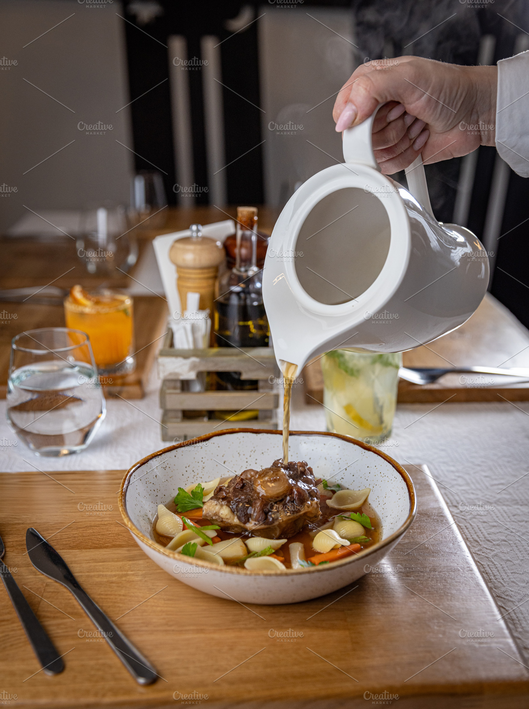 Waiter pouring broth, a Food & Drink Photo by Grafvision photography